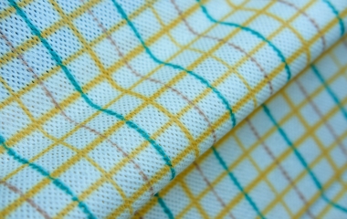 Easy clean colorful grid print nonwoven material