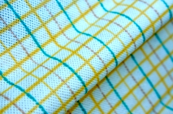 Colorful grid print spunlace nonwoven material showcasing multi-color design pattern