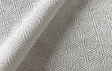 Triangle pattern 100% viscose spunlace nonwoven material for premium disposable towels and personal care applications